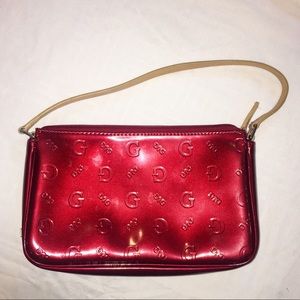 Guess maroon patent purse.